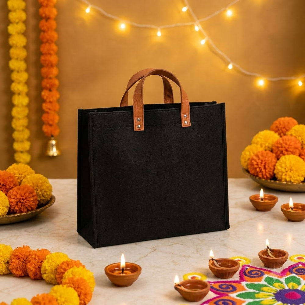 Black felt tote bag with tan leather handles from the Deepotsav Hamper